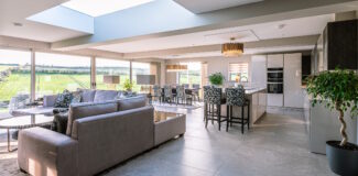 large kitchen living room extension with skylight and bi-fold doors